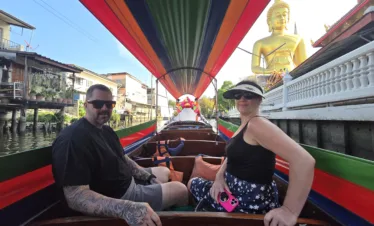 longtail boat along with the peaceful canals